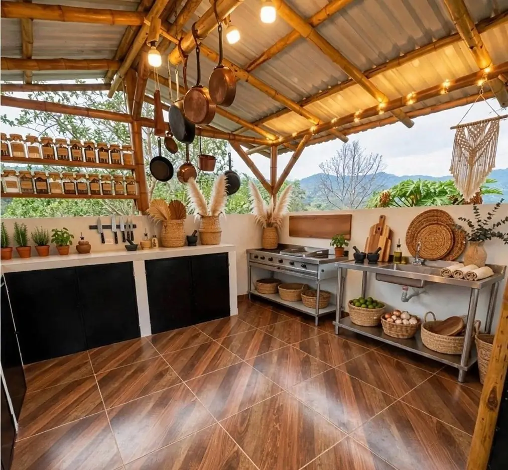 Private chef kitchen under a bamboo roof with copper pots and mountain view